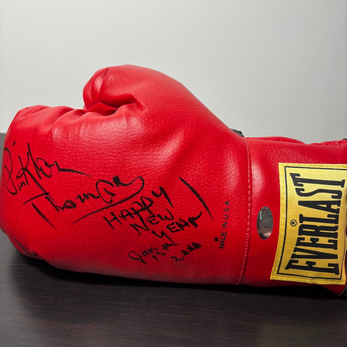 Pinklon Thomas Heavyweight Champion Authentic Signed Boxing Glove inscribed 'Happy New Year'